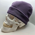 Skully Beanie - All Styles displayed on a skull model, showcasing its lightweight and comfortable design for outdoor fun.