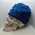 Skully Beanie - All Styles displayed on a skull model, showcasing its comfortable, fun design for outdoor activewear.
