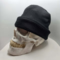 Skully Beanie - All Styles showcased on a skull, highlighting its comfortable, handmade design for outdoor adventures.