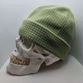 Skully Beanie - All Styles in light green on a skull model, showcasing its comfortable and lightweight design for outdoor activities.