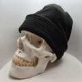 Skully Beanie - All Styles shown on a skull display, highlighting its comfortable and soft handmade design for outdoor adventures.