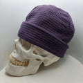 Skully Beanie - All Styles on a skull model, showcasing its comfortable, handmade design for outdoor adventures.